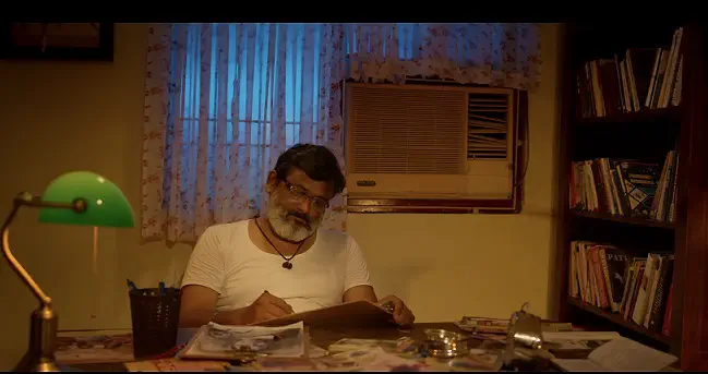 Image of scene from the film Maayakoothu